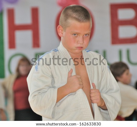 KOTSYUBYNSKE, UKRAINE - SEPTEMBER 3: The unknown boy grieves on the youth judo competition on September 3, 2013 in Kotsyubynske, Ukraine.