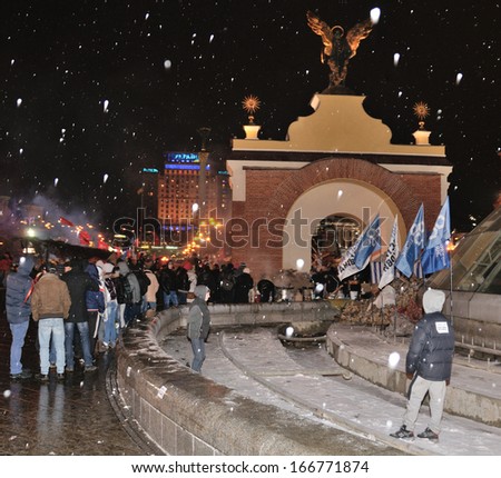 KIEV, UKRAINE - 8 DECEMBER 2013: Unknown demonstrators stand in line for food in the Independence square on December 8, 2013 in Kiev, Ukraine.