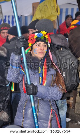 KIEV, UKRAINE -Â?Â? 15 DECEMBER 2013: Unknown demonstrator in diadem stays on the meeting on the Independence square after dispersal of proeuropean meeting on December 15, 2013 in Kiev, Ukraine.