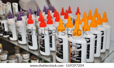 KIEV, UKRAINE - 6 MARCH 2013: Tubes with machine oil on the international bicycle exhibition on March 6, 2013 in Kiev, Ukraine.