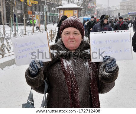 KIEV, UKRAINE Ã¢Â?Â? 22 JANUARY 2014: Unknown demonstrator shows slogans \