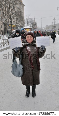 KIEV, UKRAINE -Â?Â? 22 JANUARY 2014: Unknown demonstrator shows slogans \