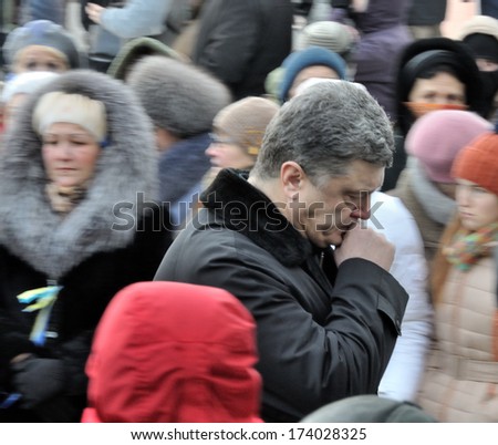 KIEV, UKRAINE -Â?Â? 25 JANUARY 2014: Ukrainian politic Petro Poroshenko visit the burial of Ukrainian revolutionary hero Michail Zhiznevskij on January 25, 2014 in Kiev, Ukraine.