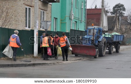 KIEV, UKRAINE - 26 FEBRUARY 2013: Unknown street-cleaner clean the street on February 26, 2013 in Kiev, Ukraine.