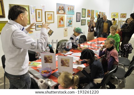 KIEV, UKRAINE - CIRCA APRIL 2014: Unknown children study useful arts on the art master-class on the art and book exhibition in Arsenal museum on April 2014 in Kiev, Ukraine