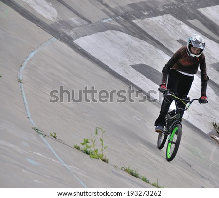 KIEV, UKRAINE Ã¢Â?Â? 17 MAY 2014: Unkonwn cyclist tests a cyclie on the old cycle track on May 17, 2014 in Kiev, Ukraine