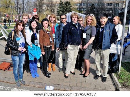 DONETSK, UKRAINE - CIRCA MAY 2013: The commissar of UCI Elita Grasina makes photo with college-judges after cycling competition The Grand Prix of Donetsk on May 2013 in Donetsk, Ukraine.