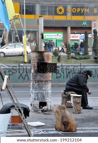 KIEV, UKRAINE - CIRCA FEBRUARY 2014: Unknown demonstrator rests after street fights on Ukrainian revolution on February 2014 in Kiev, Ukraine.