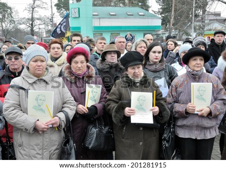 KIEV, UKRAINE - CIRCA FEBRUARY 2014: Unknown people pray on a requiem mass by died people during Ukrainian revolution on February 2014 in Kiev, Ukraine.