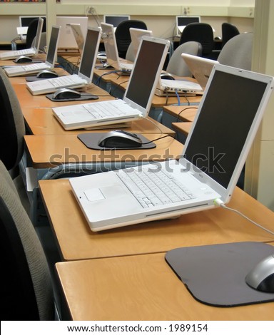 School computer lab with desks and chairs.