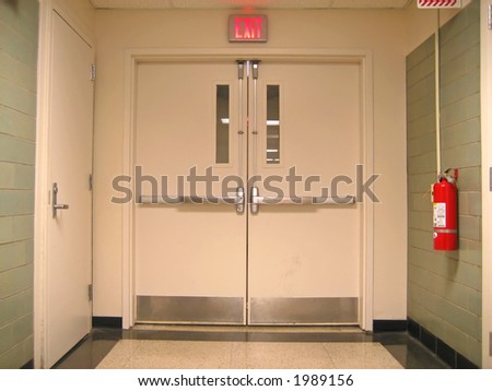 School Emergency Exit with Exit Sign and Fire Extinguisher.