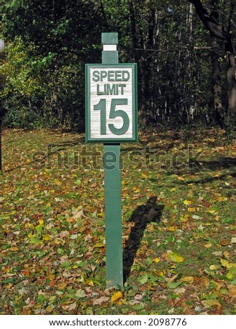 Green and White 15 Miles Per Hour Speed Limit Sign