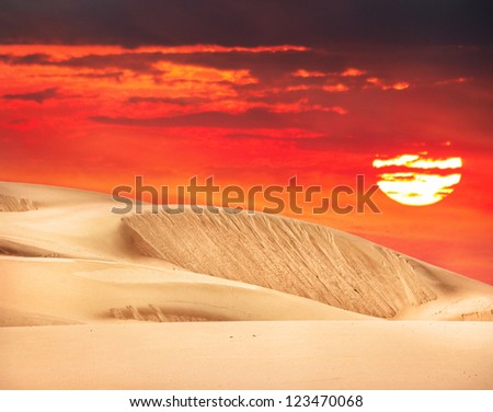 Desert with orange sky and big sun in Kazakhstan, Central Asia