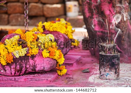Saffron flower garlands and incense near Arambol temple Goa India Saffron flower garlands and incense near Arambol temple Goa India