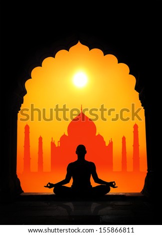 Man silhouette doing meditation at Taj Mahal background in India