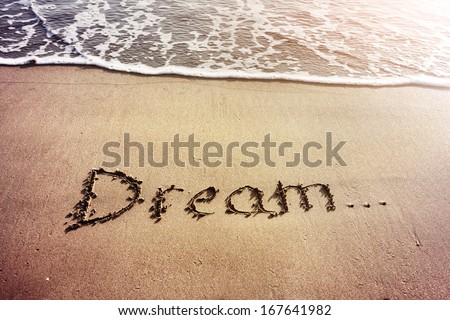 Dream title on the sand beach near the ocean