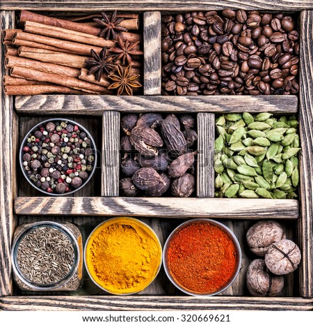 Spices, coffee and walnuts in the wooden box