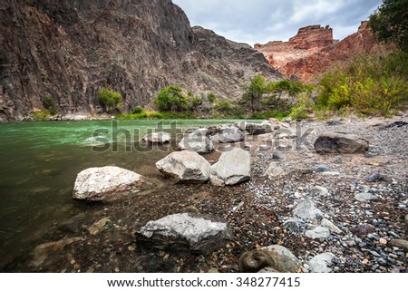 Charyn river in canyon with rocks in the desert at overcast sky in Kazakhstan