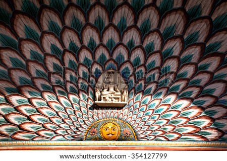 Lotus gate with sun painting and god statue close up in City Palace of Jaipur, Rajasthan, India