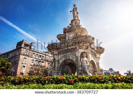 Flora Fountain and Oriental Old Building at blue sky in sunny at fort area in Mumbai, Maharashtra, India