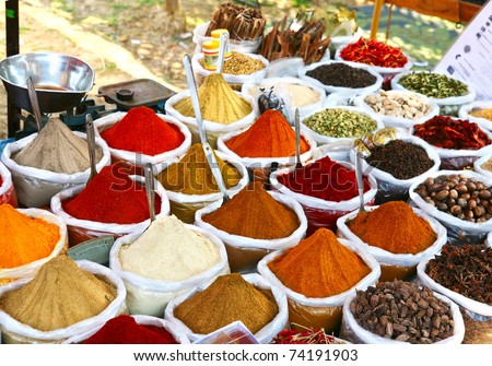 Various of Indian colored powder spices on the Anjuna flea market in India, Goa.