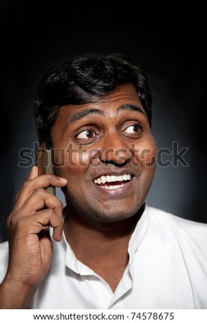 des ptits truc marrant que j apprend en lisant mes cours - Page 5 Stock-photo-happy-indian-man-talking-on-the-cell-phone-at-black-background-74578675