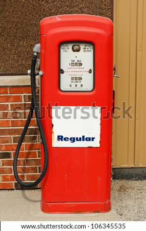Old. red gas pump for regular gas priced at 30.9 cents per gallon.