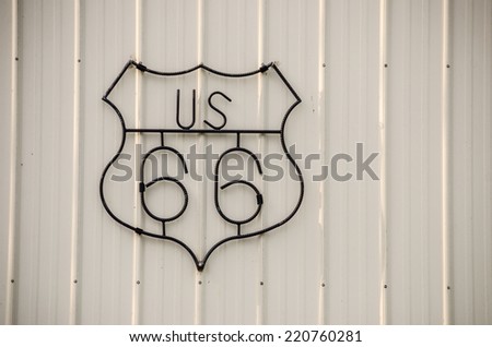 Wrought iron sign with a crooked S for US Route 66
