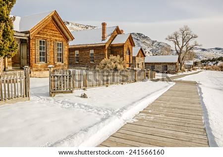 Homes and a church on the main street of Bannack State Park in Montana on a winter day