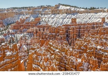 Hoodoos, canyon walls, and fins make a striking contrast against the snow in Bryce Canyon National Park