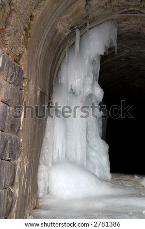 Ice formation resembling a woman acting as guardian in Wickes Tunnel in Montana