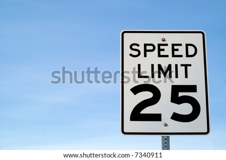 Twenty-five mile per hour speed limit sign against blue sky