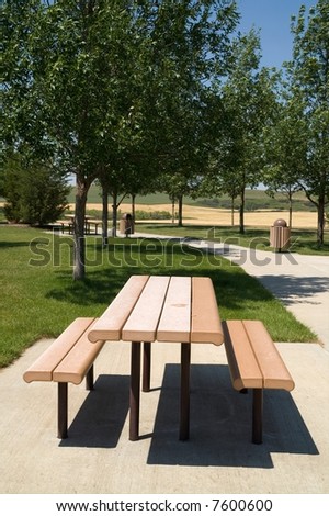 Picnic table and walking path at rest area found along an interstate highway in the USA