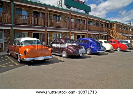 Classic cars resting at a motel until it is time for the show