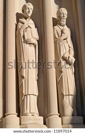 Sculptures of St. Thomas Aquinas and St. Augustine on an early 20th century Cathedral