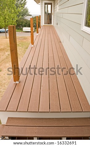 New composite deck with treated posts waiting for handrail