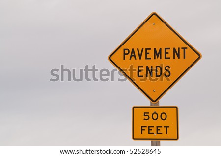 Warning sign for end of pavement in 500 feet