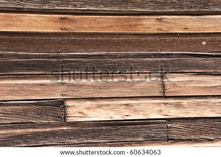 Beautiful shades of weathered wood on the side of a building in a long abandoned ghost town - great background with lots of texture