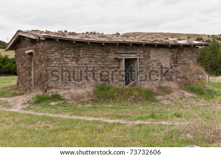 Reconstruction of a sod house that had been built nearby.  Cactus is growing on the roof.