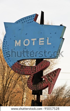 This old, rusty, faded motel sign must have been quite nice when it was new.