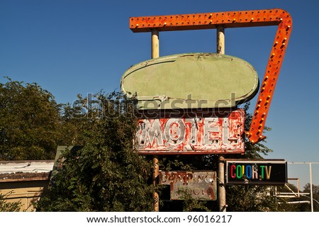 Retro motel sign on Route 66 with signs for a swimming pool and color TV