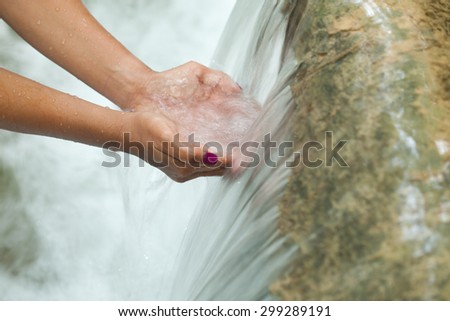 Care water in your hands in the world on nature
