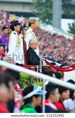 SINGAPORE - AUGUST 09: President Dr Tony Tan watching the NDP performance at the VIP gallery during National Day Parade 2012 on August 09, 2012 in Singapore