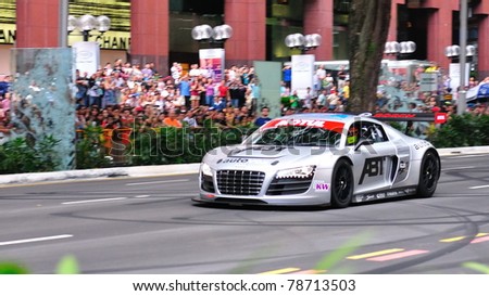 SINGAPORE - APRIL 24: Alex Yoong, racing down the lanes in Audi R8 LMS on the streets of Orchard Road in Red Bull Speed Street Singapore on April 24, 2011 in Singapore.