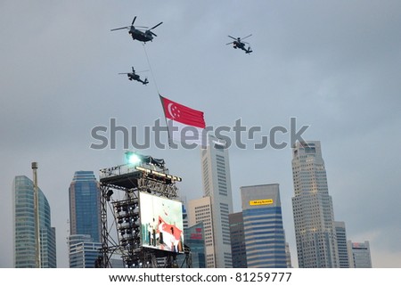 SINGAPORE - JUNE 25: Chinook helicopter flying Singapore national flag at National Day Parade Singapore 2011 Combined Rehearsal on June 25, 2011 in Singapore.