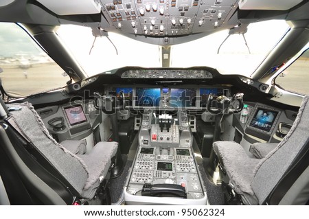 SINGAPORE - FEBRUARY 12: Interior of the cockpit with control panel and throttle in the new Boeing 787 Dreamliner at Singapore Airshow February 12, 2012 in Singapore