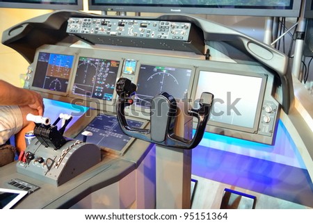 SINGAPORE - FEBRUARY 12: Flight control panel with throttle of Boeing 787 Dreamliner simulator at Singapore Airshow February 12, 2012 in Singapore