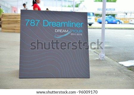 SINGAPORE - FEBRUARY 12: A welcome board to the guests for the 787 Dreamliner tour at the entrance at Singapore Airshow February 12, 2012 in Singapore