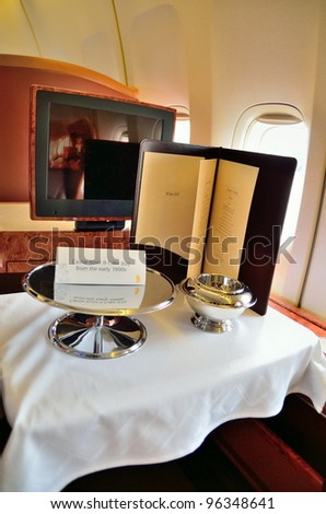SINGAPORE - FEBRUARY 17: First class cabin cavier bowl and cake tray in Singapore Airlines' (SIA) last Boeing 747-400 aircraft at Singapore Airshow on February 17, 2012 in Singapore