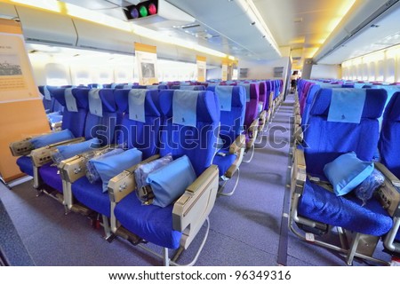 SINGAPORE - FEBRUARY 17: Economy class cabin in Singapore Airlines\' (SIA) last Boeing 747-400 aircraft at Singapore Airshow on  February 17, 2012 in Singapore